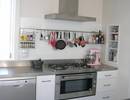 Stainless bench and rangehood with rail for utensils