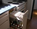 Pull-out drawer for spices and bottles