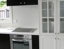 Custom built kitchen with glass display cabinet