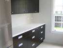 Acrylic benchtop, veneer doors, recessed handles