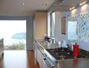 Kitchen with recessed handles and granite top