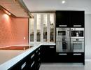 Kiwi Kitchens custom built kitchen featuring acrylic bench, recessed handles, double wall oven.