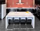 Kitchen featuring white acrylic benchtop and island
